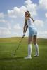 blue skirt girl teeing off.jpg